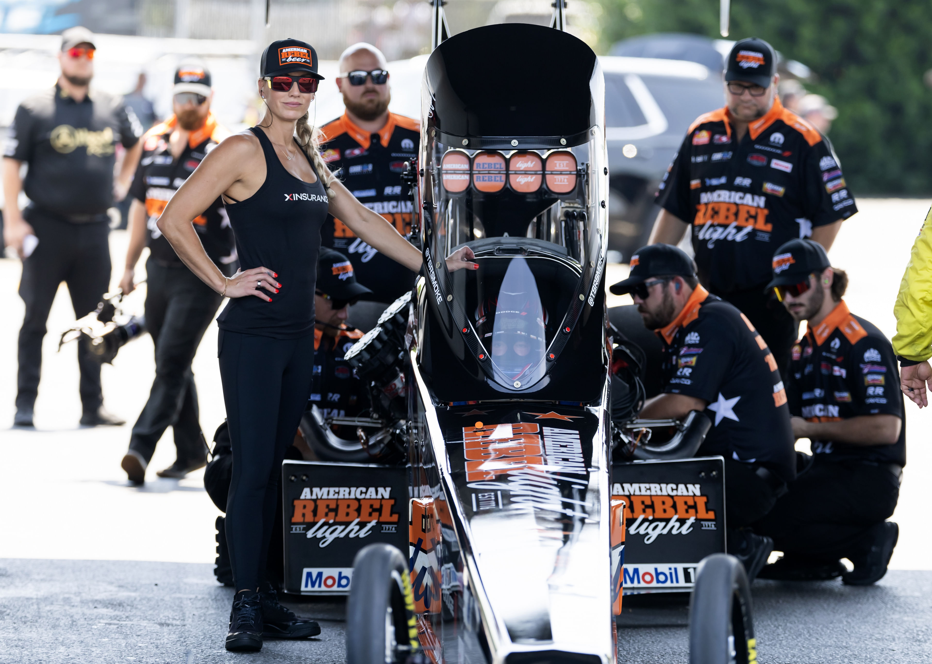 Leah Pruett, alongside her husband and NHRA top fuel driver Tony Stewart, during qualifying. Source: Imagn
